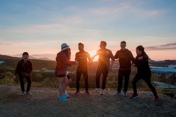 a group against a sunset